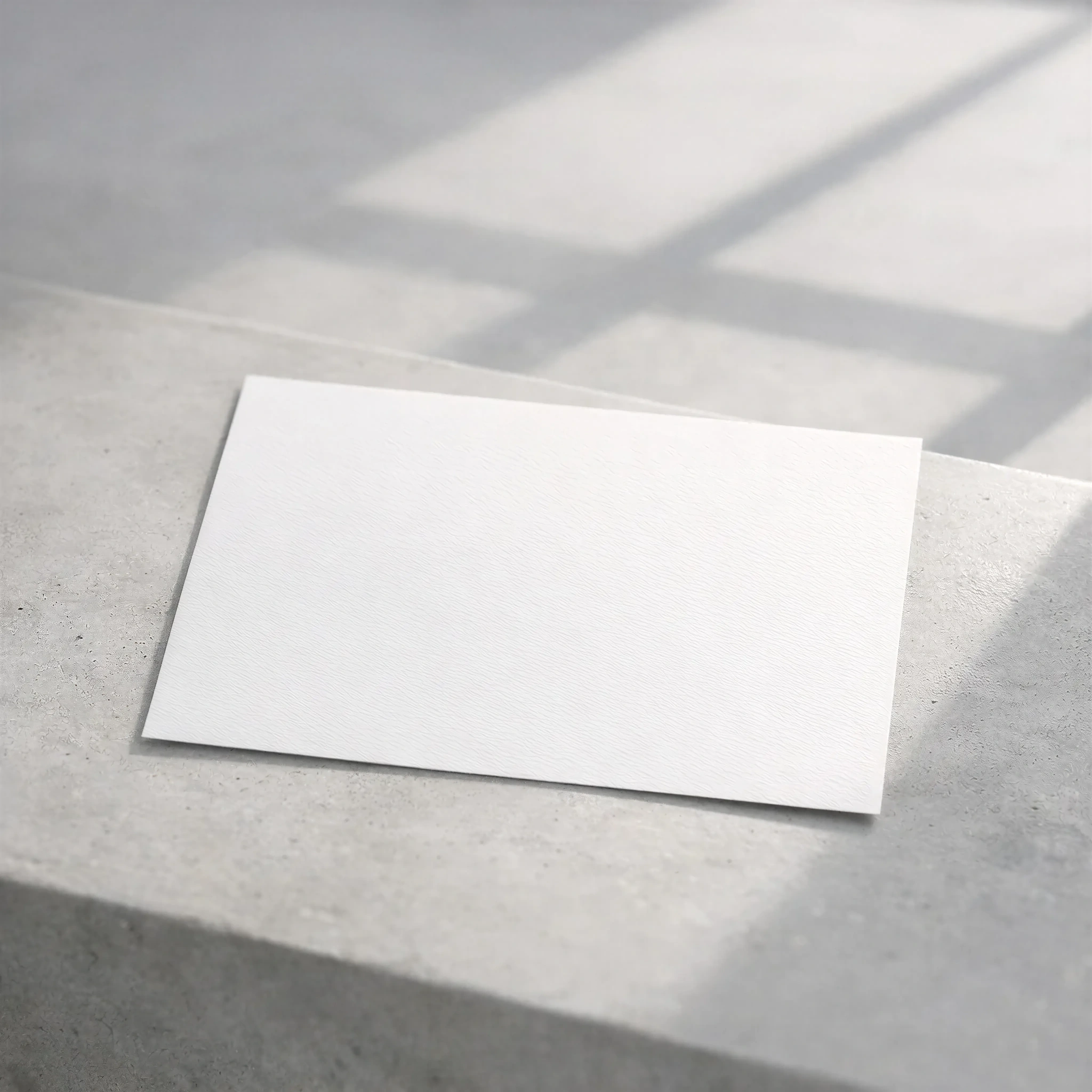 Minimalist White Greeting Card Mockup on Concrete